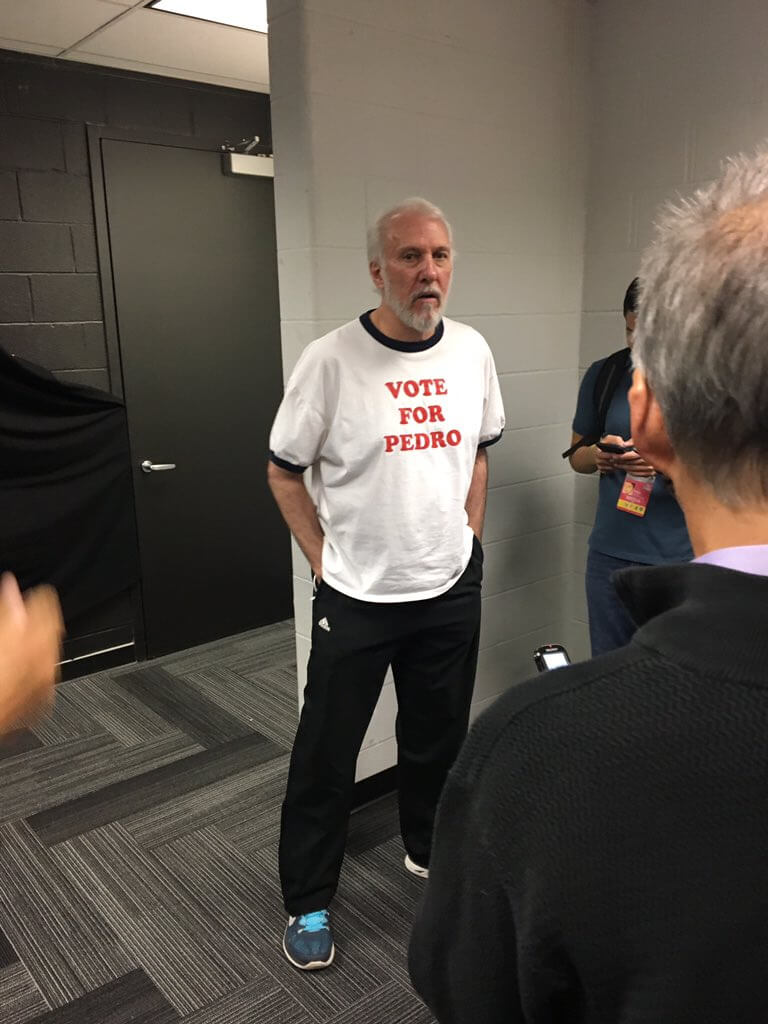 Greg Popovich wearing a Vote for Pedro T-shirt