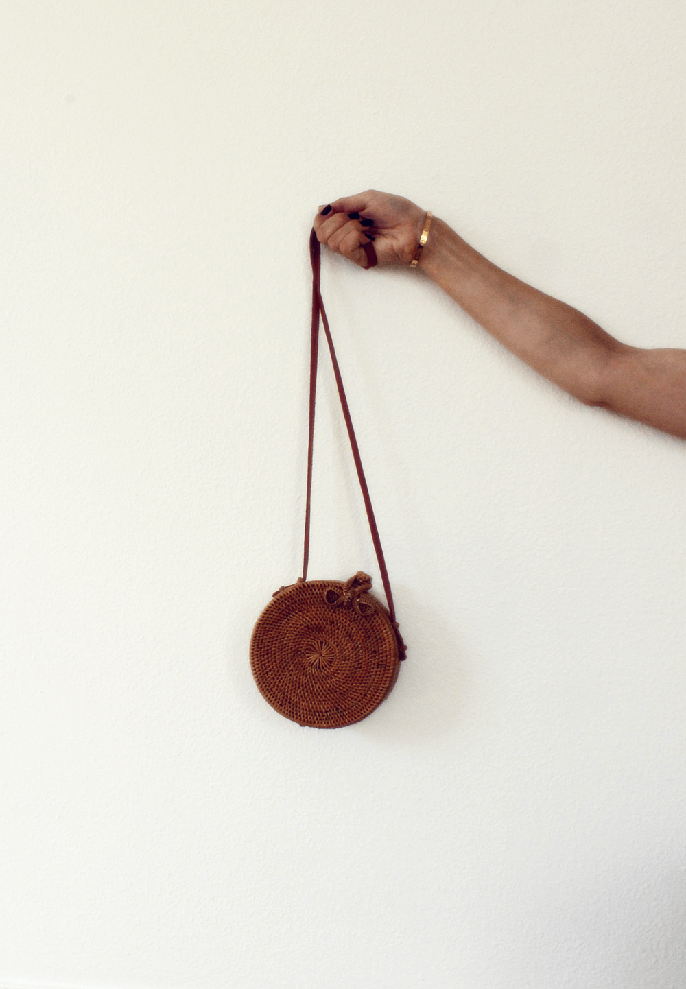 The mass hysteria around round bali straw bags is real